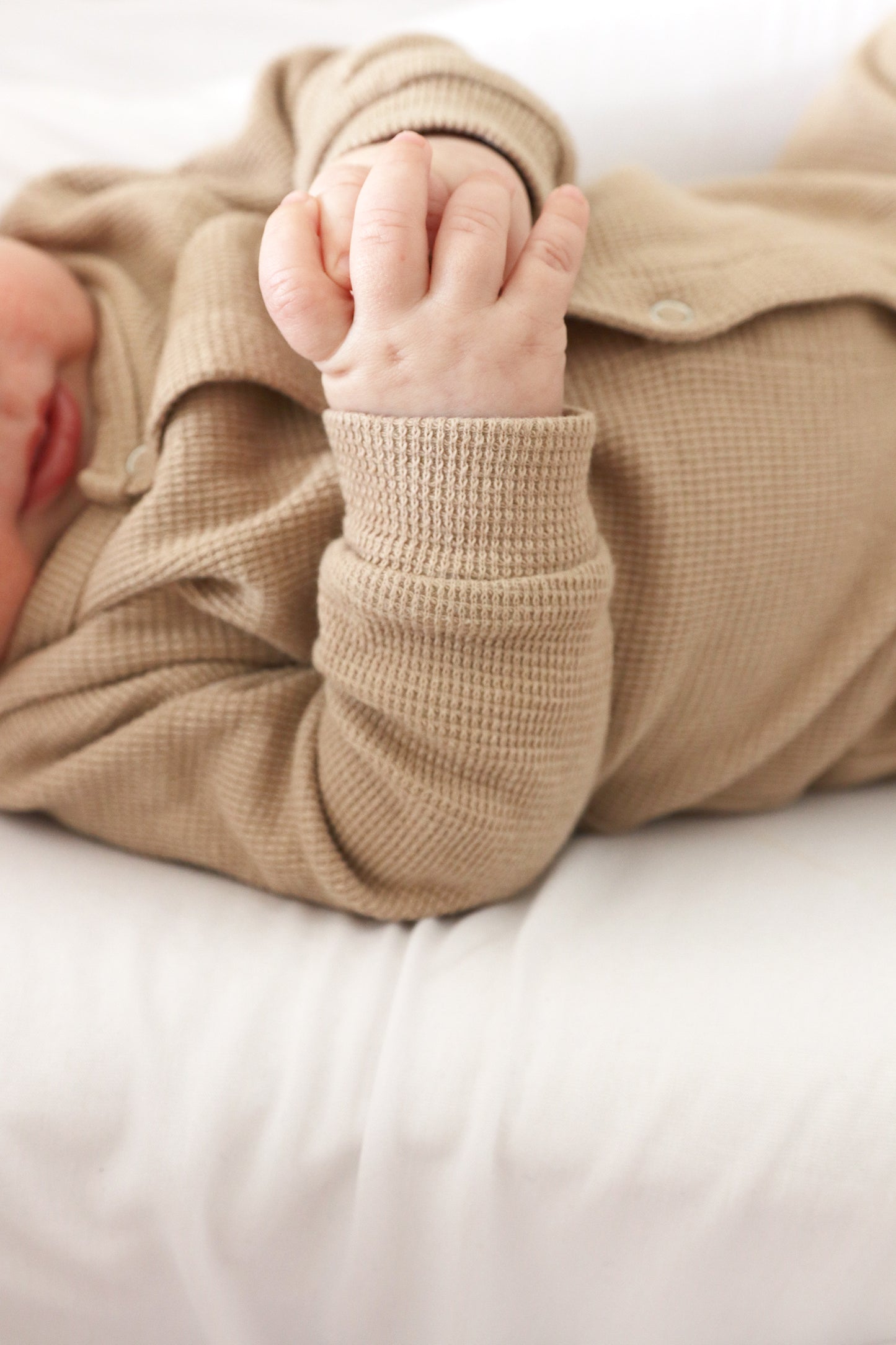 Gift shopping for infant essentials or creating a baby registry, you have found the best neutral tone unisex 100% cotton waffle sleepsuit onesie.