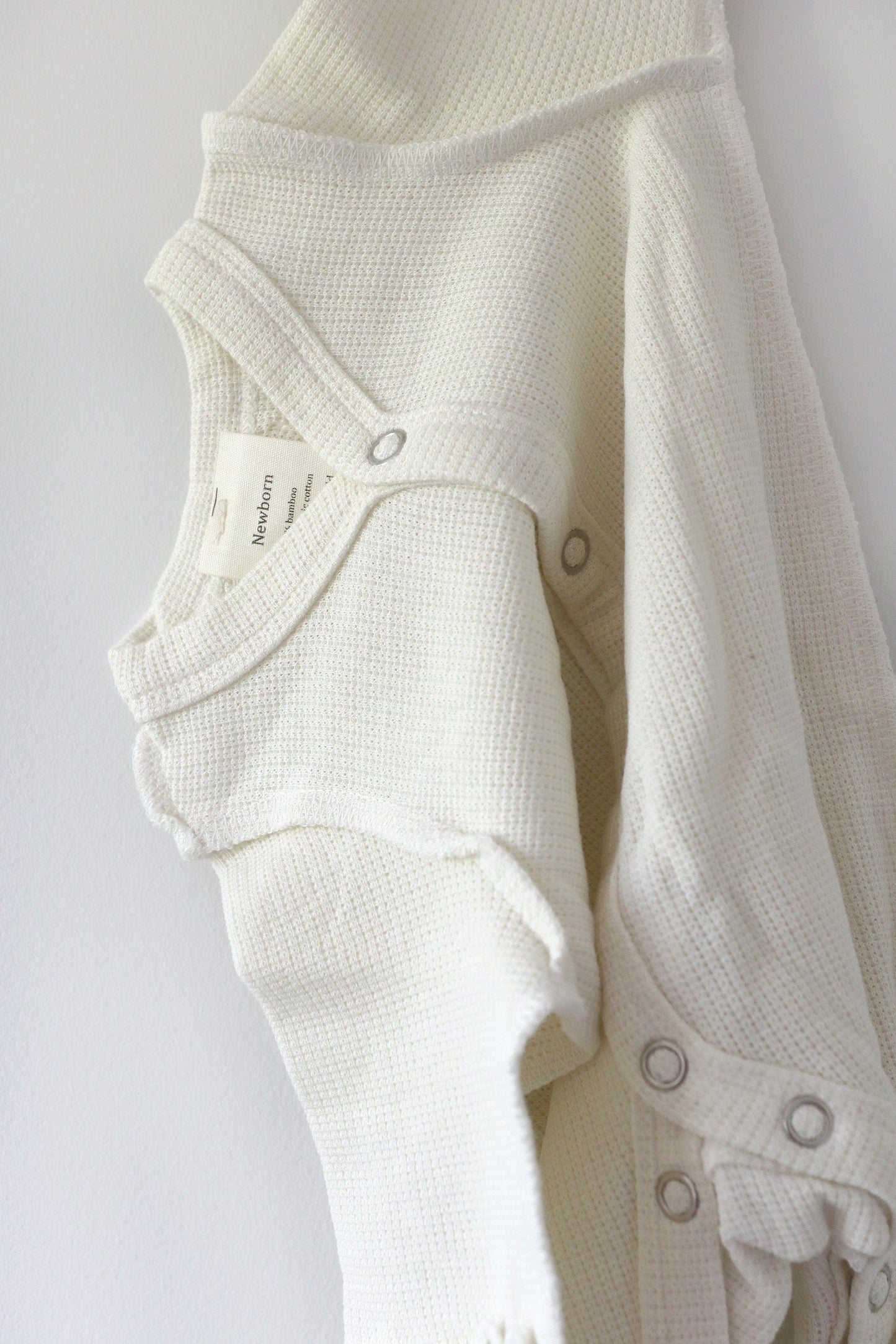 Gift shopping for infant essentials or creating a baby registry, you have found the best neutral tone unisex sleepsuit onesie, that is especially perfect for sensitive skin and newborn skin rash.
